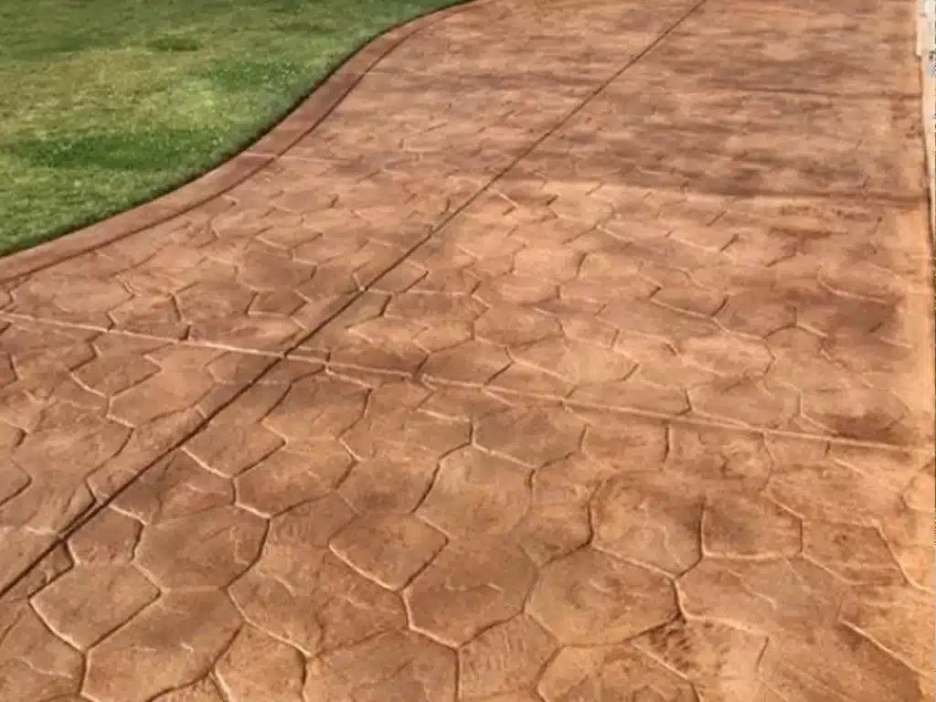 Cleaned and sealed stained concrete driveway